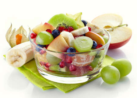 Bowl of fresh healthy fruit salad on white backgroundの写真素材