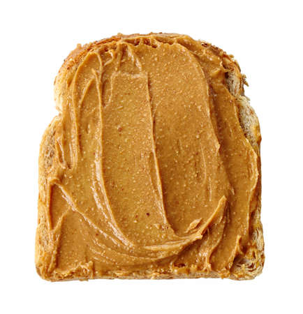 Slice of bread with peanut butter isolated on white backgroundの写真素材