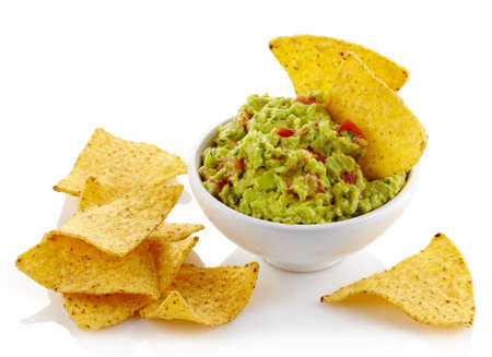 Bowl of guacamole dip and nachos isolated on white backgroundの写真素材