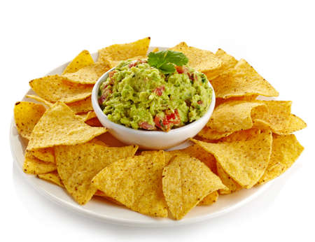 Plate of guacamole dip and nachos isolated on white backgroundの写真素材