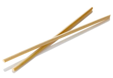 Wooden chopsticks isolated on white backgroundの写真素材