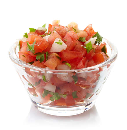 Bowl of fresh salsa dip isolated on white backgroundの写真素材