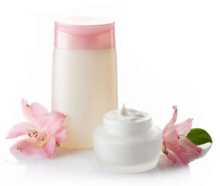 Bottle of cosmetic lotion and jar of cream isolated on white backgroundの写真素材