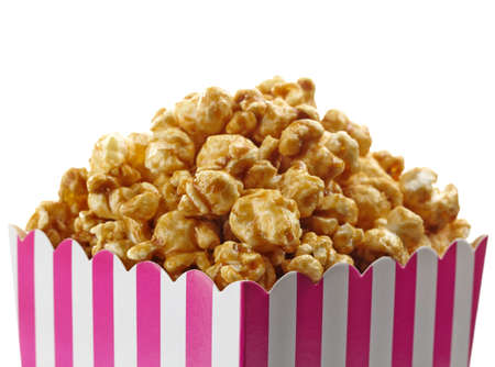 Striped box of caramel popcorn isolated on white backgroundの写真素材