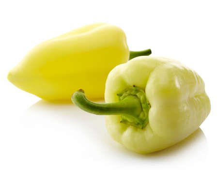 Two sweet yellow peppers isolated on white backgroundの写真素材