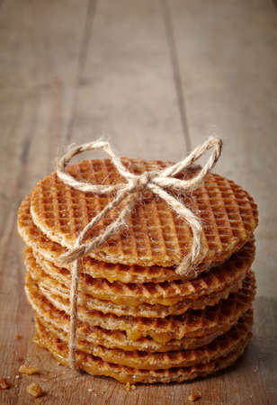 Stack of dutch waffles on wooden backgroundの写真素材
