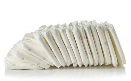 Stack of diapers isolated on white backgroundの写真素材