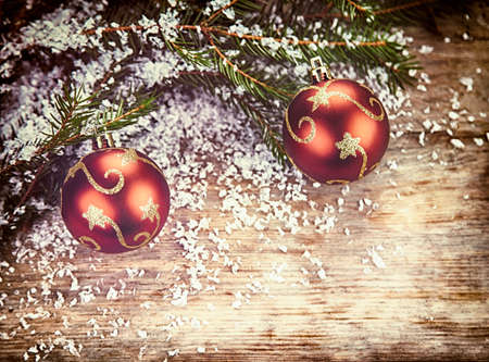Red Christmas decorations on wooden backgroundの写真素材