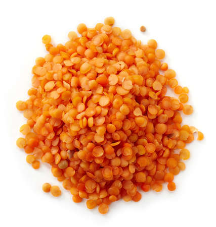 Heap of red turkish lentils isolated on white background (top view)の写真素材