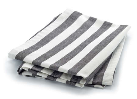 Folded striped cotton napkin isolated on white backgroundの写真素材