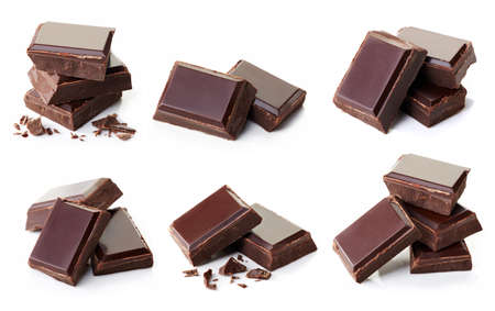 Collection of various dark chocolate pieces isolated on white backgroundの写真素材