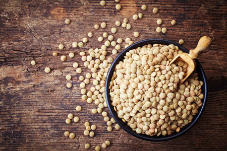 Bowl of canadian lentils on wooden backgroundの写真素材