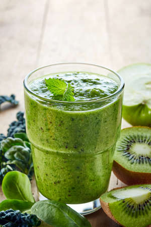 Glass of healthy green vegetable and fruit smoothieの写真素材