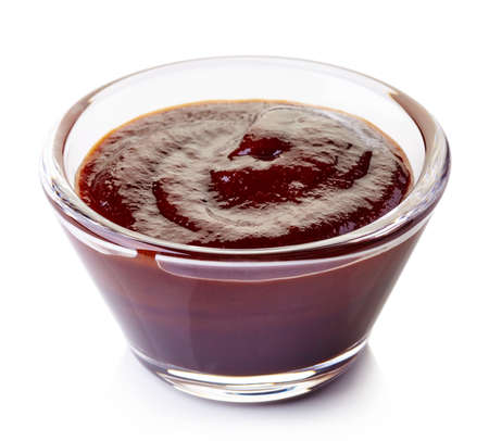 Bowl of barbecue sauce isolated on white backgroundの写真素材