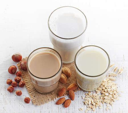 Different vegan milk: almond milk, hazelnut milk and oat milkの写真素材