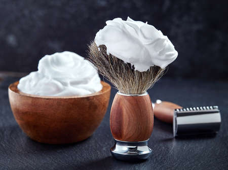 Wooden shaving accessories on black backgroundの写真素材
