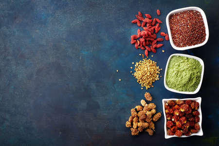 Various superfoods on old blue background. Top viewの写真素材
