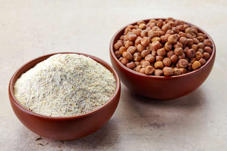 Bowl of gray peas flour and bowl of gray peas. Gluten freeの写真素材