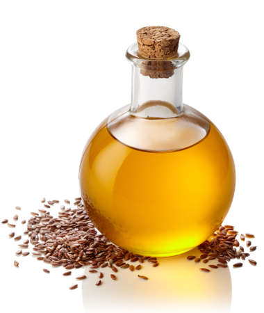 Bottle of linseed oil isolated on white backgroundの写真素材