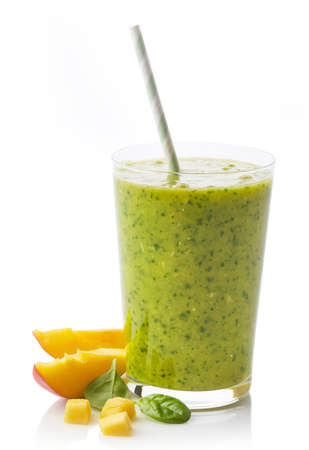 Glass of fresh healthy fruit and spinach smoothie isolated on white backgroundの写真素材