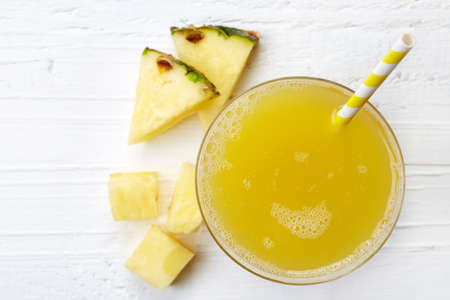 Glass of fresh pineapple juice from top viewの写真素材
