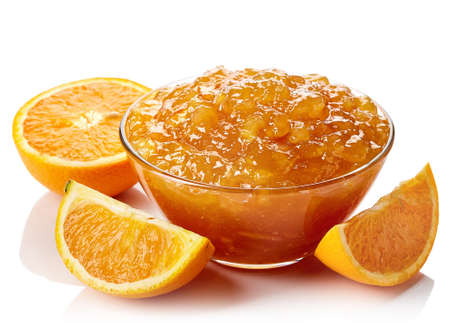 Bowl of orange jam isolated on white backgroundの写真素材