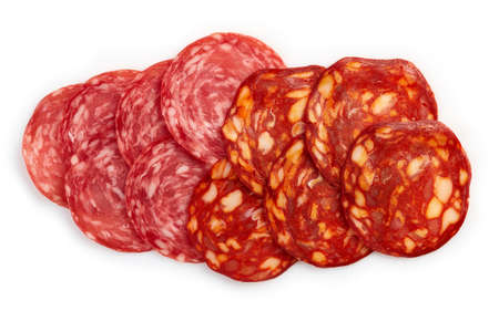 Slices of chorizo sausage and salami isolated on white background. From top viewの写真素材