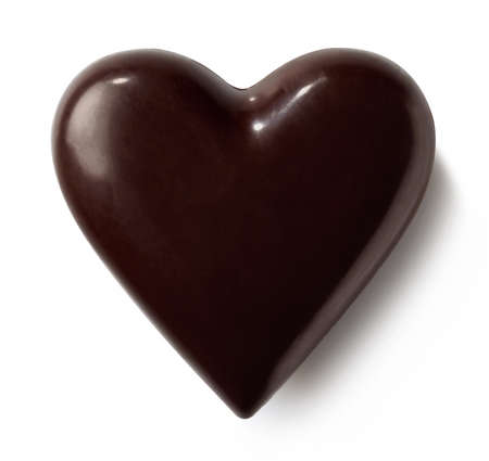 Dark chocolate heart isolated on white background. Top viewの写真素材