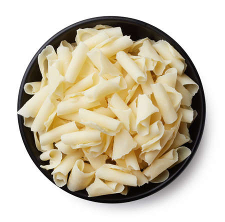 Bowl of white chocolate shavings isolated on white background. Top viewの写真素材