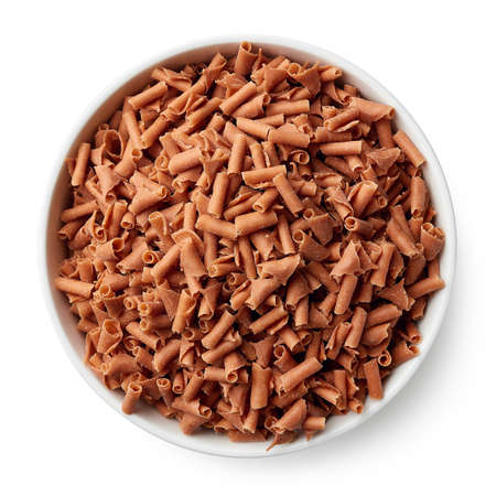 Bowl of caramel shavings isolated on white background. Top viewの写真素材