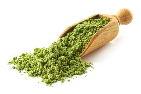 Scoop of green matcha tea powder isolated on white backgroundの写真素材