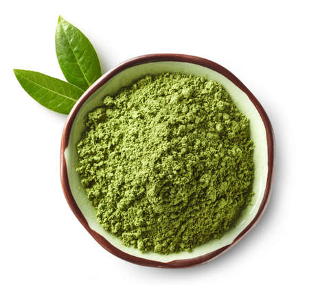Bowl of green matcha tea powder isolated on white background. Top viewの写真素材