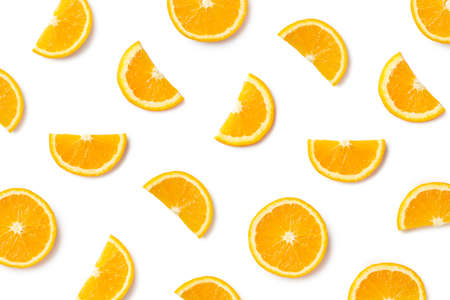 Fruit pattern of orange slices isolated on white background. Top view. Flat lay