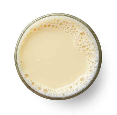 Glass of fresh vegan soy milk isolated on white background, top view. Dairy free, plant based drink.の写真素材