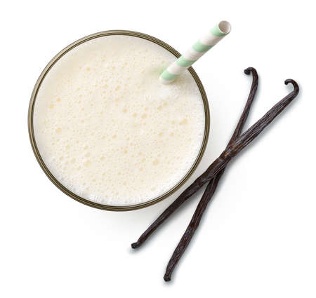 Glass of fresh vanilla milkshake or smoothie isolated on white background, top viewの写真素材
