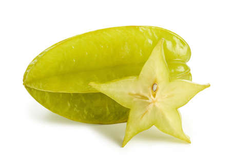 Fresh ripe whole and sliced carambola or star fruit isolated on white backgroundの写真素材