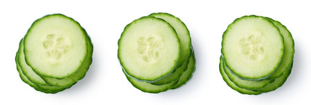 Three various stacks of fresh cucumber slices isolated on white background, top view, close-upの写真素材