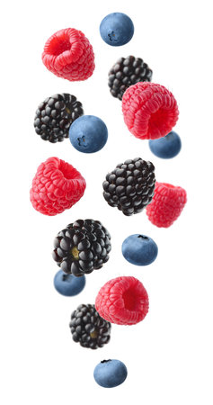 Collection of various falling fresh ripe wild berries isolated on white background. Raspberry, blackberry and blueberry. Vertical compositionの写真素材
