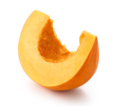 One fresh slice of orange pumpkin isolated on white backgroundの写真素材