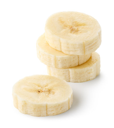 Stack of banana slices isolated on white backgroundの写真素材