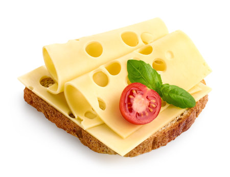 Bread toast sandwich with Maasdam cheese slices and cherry tomato isolated on white backgroundの写真素材