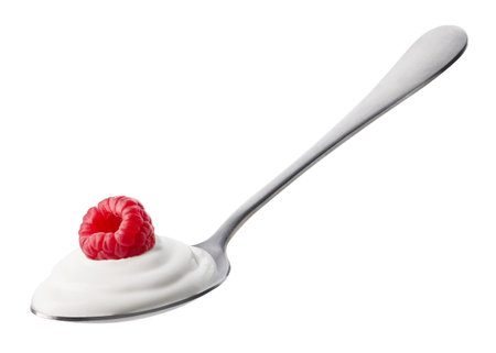 Spoon of fresh creamy greek yogurt and raspberry isolated on white backgroundの写真素材