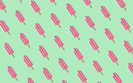 Colorful pink fruit ice cream pattern on pastel mint background. Sunny summer mood. Strawberry, watermelon and raspberry flavorの写真素材