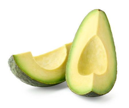 Two fresh ripe avocado slices isolated on white backgroundの写真素材