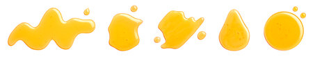 Set of various yellow honey spill, splash and drops isolated on white background, top viewの写真素材