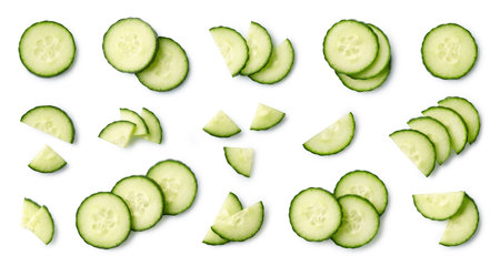 Set or collection of various fresh cucumber slices isolated on white background. Top viewの写真素材