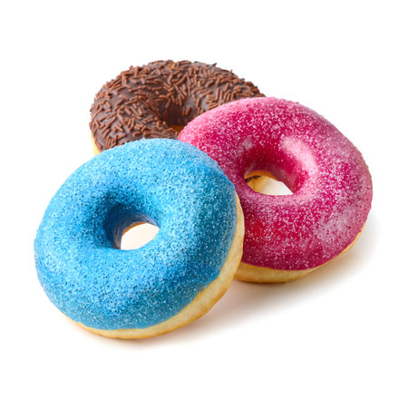 Stack of three different colorful donuts isolated on white backgroundの写真素材