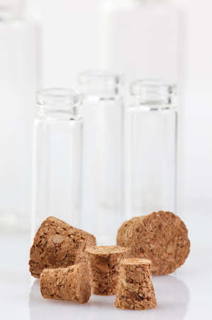 A glass container with a cork on a white background. Close-up.の写真素材
