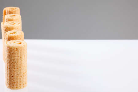 Wafer rolls. Gtoup of tasty crispy tube wafer on white background. Dessert.の写真素材