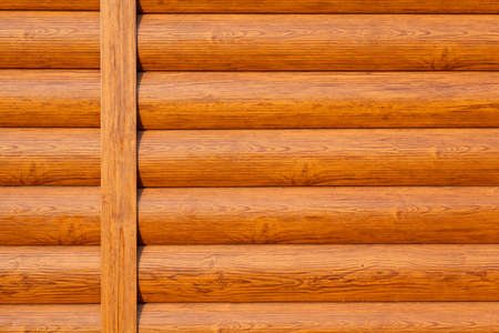Wall of a log house with texture and wood knots exterior. Backgroud texture.